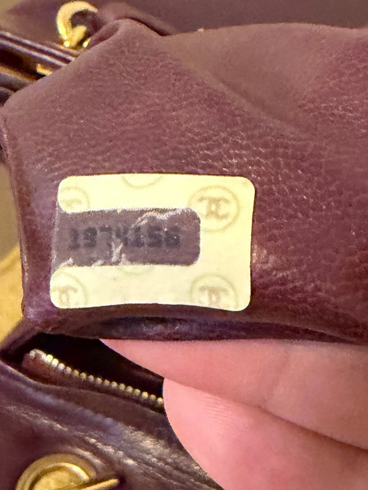 Back of burgundy shoulder bag